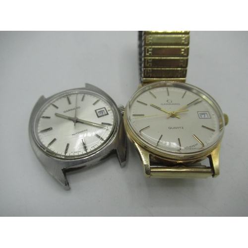 95 - Garrard quartz wrist watch with date, 9ct gold case stamped .375, and bearing presentation inscripti... 