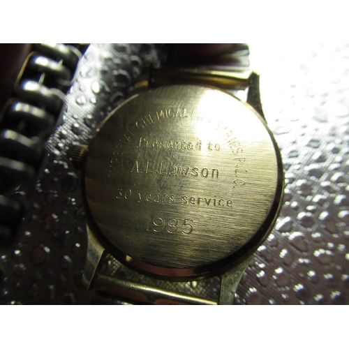 95 - Garrard quartz wrist watch with date, 9ct gold case stamped .375, and bearing presentation inscripti... 
