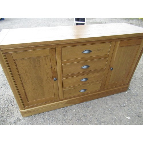 382 - Oak dresser, with three central drawers enclosed by a pair of cupboard doors W156cm D50cm H90cm