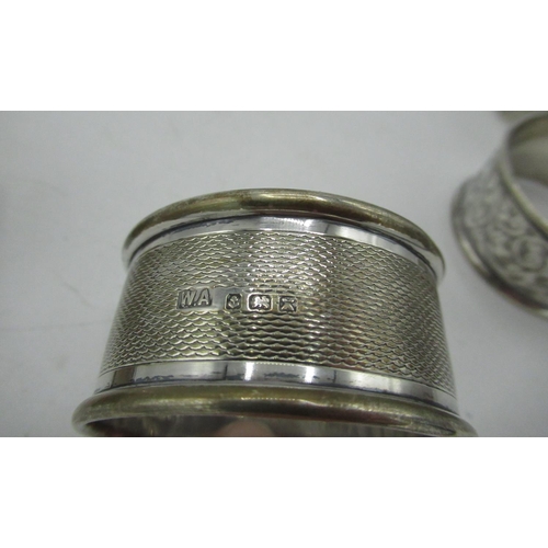 52 - Five 20th C silver hallmarked napkin rings, variously decorated, Chester and Birmingham 1907-1970 (5... 