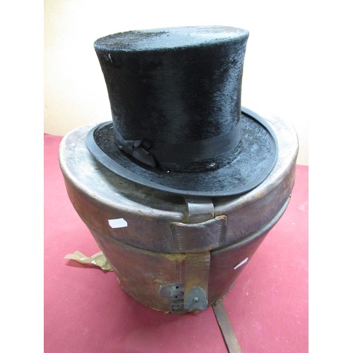 241 - Tryner Lynn, Newark and Grantham late 19th century black silk top hat in original brown leather trav... 