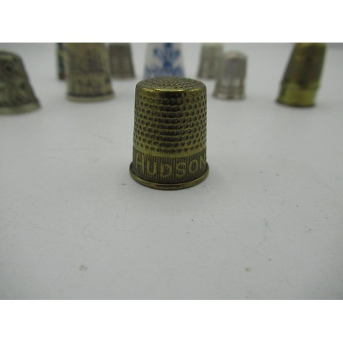 456 - Collector's thimbles including three silver and one advertising Hudson's soap