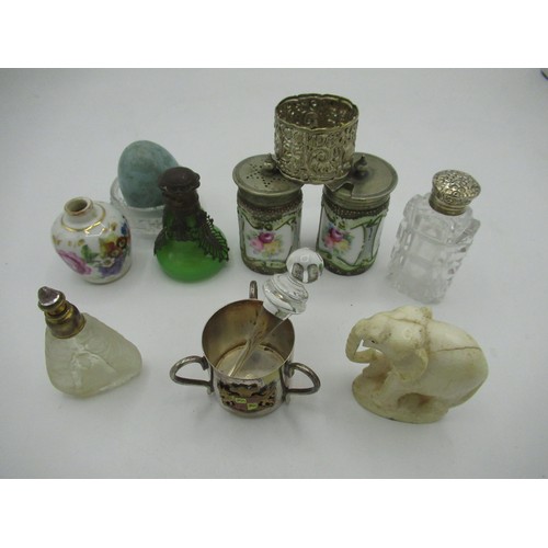 459 - Collection of scent bottles, a pair of condiment pots with floral design, an ornate white metal napk... 