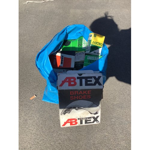 134 - Bag containing brake shoes, crosland filters etc