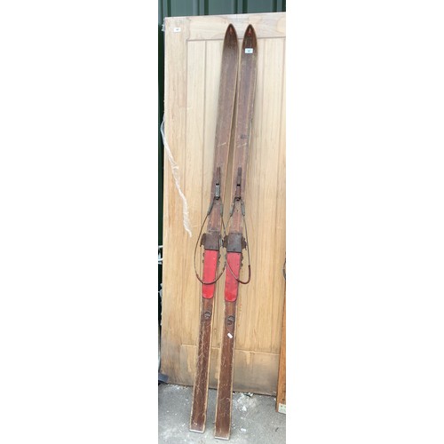 51 - Pair of vintage wooden bonna skis lacking poles