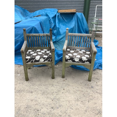 358 - Two teak garden seats