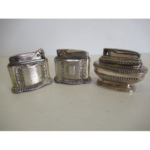91 - Three silver plated table lighters including Queen Anne Ronson 2 Ronson Diana (3)