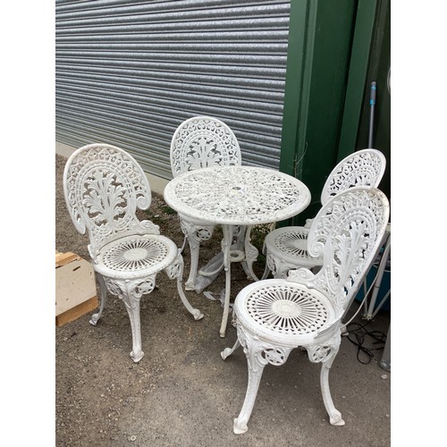 369 - Alloy garden table with four ornate chairs