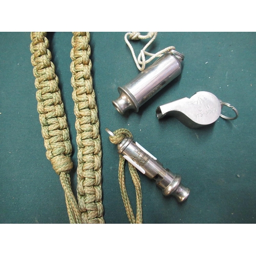 144 - Group of whistles including an ARP J Hudson and Co whistle with lanyard, a acme siren whistle and a ... 