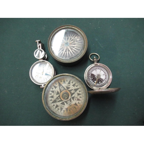 145 - Two brass cased pocket compasses one with lift off lid, another French made map folding map reading ... 