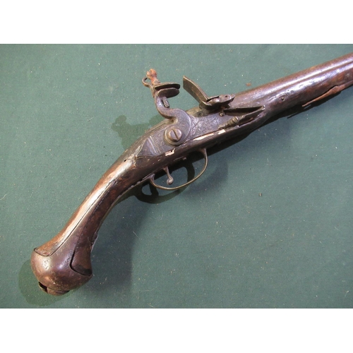 71 - 18th C continental flintlock pistol with12 inch barrel with traces of engraved detail to the lock wi... 