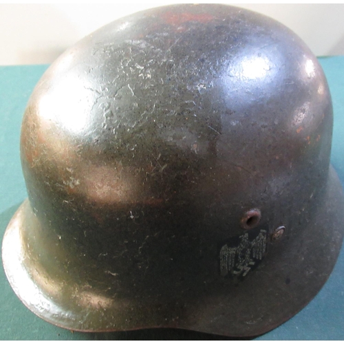 13 - German WWII period steel army helmet with double decal including tricolour, complete with liner and ... 
