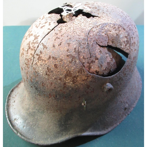 22 - WWI period German M16 battle damaged relic state steel helmet