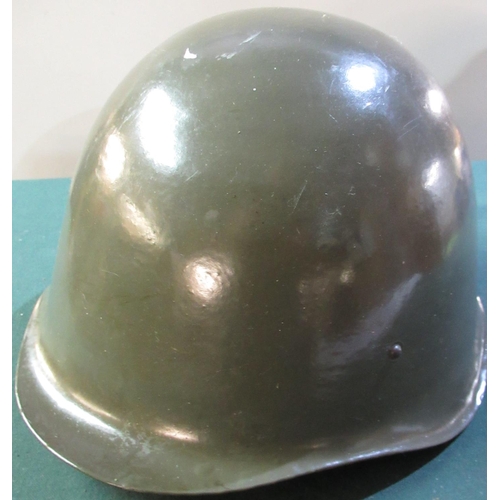 39 - Possible reproduction of a Soviet block post WWII steel helmet with liner and straps
