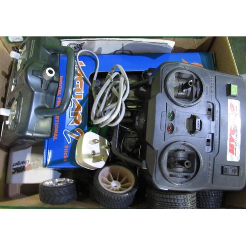 939 - Two remote control cars (Subaru Deagostini and BMW Thunder Tiger ) and a quantity of remote controls... 