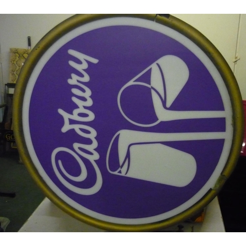 946 - Double sided circular advertisement sign for Cadbury's milk chocolate with wall mounted bracket and ... 