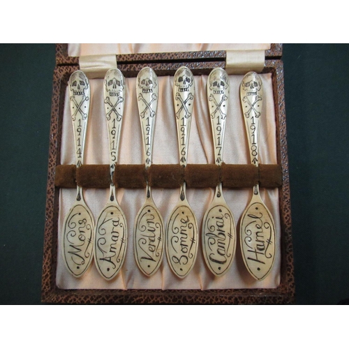 164 - Unusual cased set of six prison of war style carved bone spoons, decorated with scull and cross bone... 