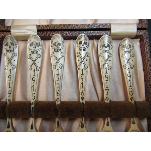 164 - Unusual cased set of six prison of war style carved bone spoons, decorated with scull and cross bone... 