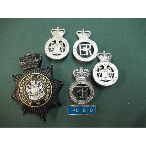 59 - Collection of Northumberland constabulary cap badges and PC badge and a night time constabulary badg... 