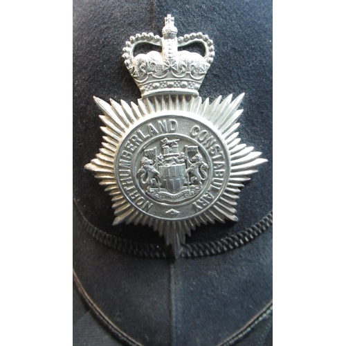 60 - Northumberland constabulary police helmet and sergeants helmet