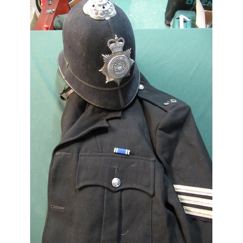 61 - Northumberland constabulary police helmet and sergeants helmet with medal ribbon and badge number