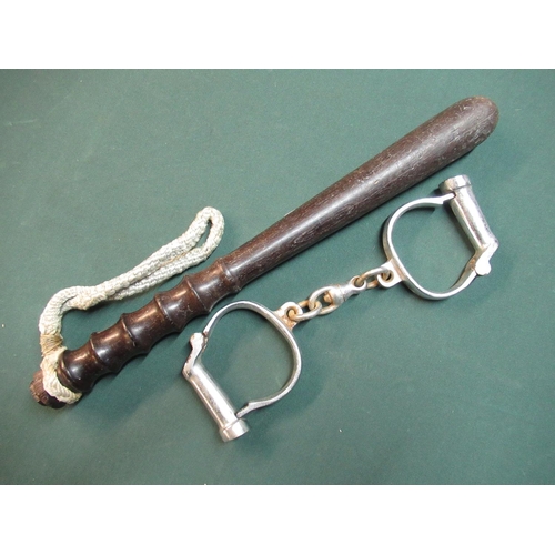 63 - Turned wood police truncheon and handcuffs