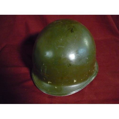 32 - USA occupation of Berlin post WWII steel helmet with chin strap, lacking liner, with traces of decal