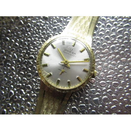 53 - Vintage fashion watch, gold plated case on integral bracelet snap on case back, diameter including c... 
