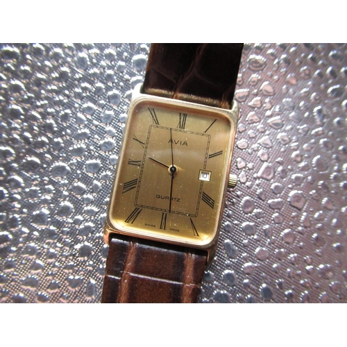 55 - Avia quartz dress wristwatch with date 9ct gold rectangular case on brown lizard skin strap, snap on... 