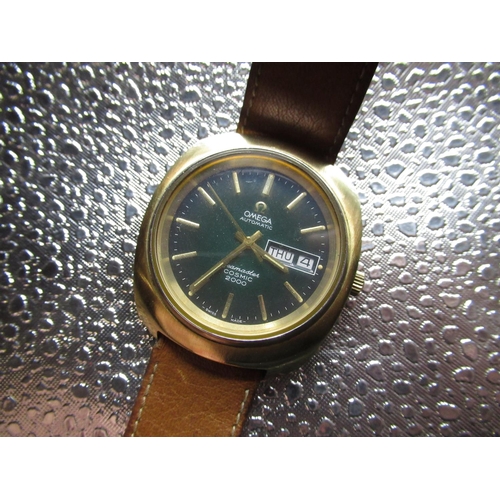 59 - Omega Seamaster Cosmic 2000 automatic wristwatch with date, brushed gold plated case, stainless stee... 