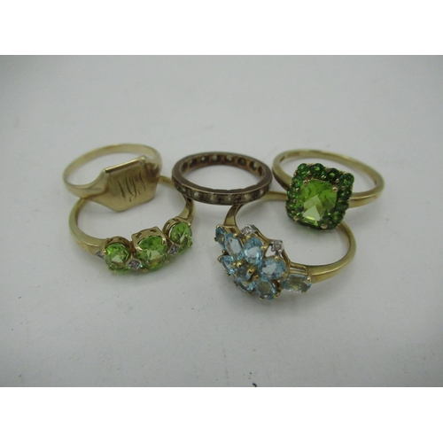 8 - 9ct gold Halo style peridot ring Size R, gross 2.8g and a 9ct gold aquamarine ring Size S gross 2.1g... 