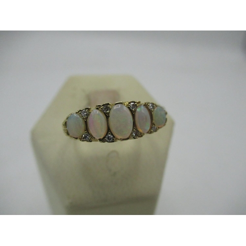 96 - Hallmarked 9ct gold opal and eight stone diamond ring Size O, 4.1g