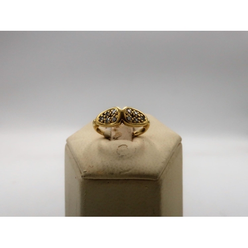 103 - 18ct gold bow shaped ring set with 10 diamonds size I 1/2 2.3g