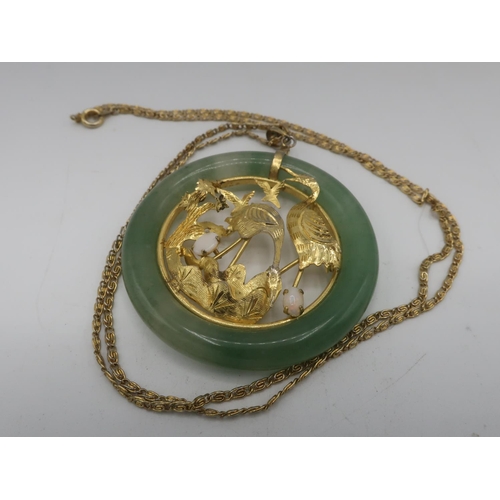 104 - Chinese circular jade pendant with inset 18ct gold open work study of storks with two mounted opals ... 