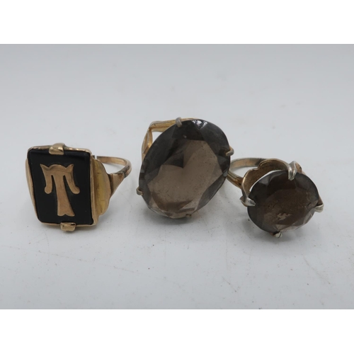 118 - Dress ring with oval stone, another similar with circular stone and a signet ring initialled T (3)