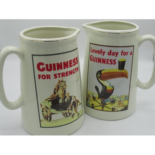 156 - Pair of reprox Guinness jugs, one featuring the Guinness toucan with official merchandise mark to bo... 