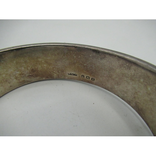 662 - Hallmarked Sterling silver hinged bangle with safety chain stamped Birmingham,1972 1.5ozt, a silver ... 