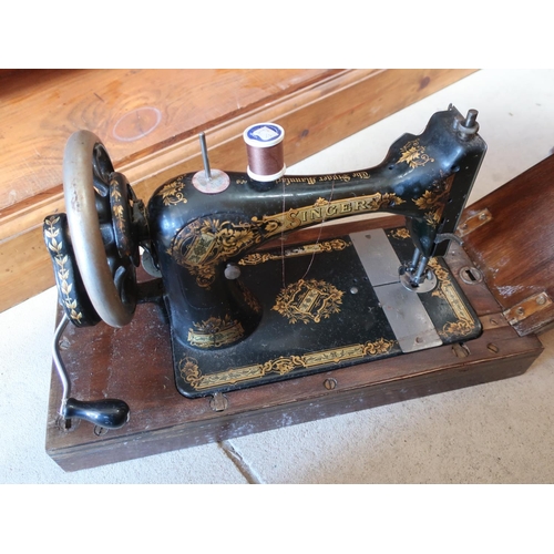 673 - Singer hand sewing machine in dome topped case