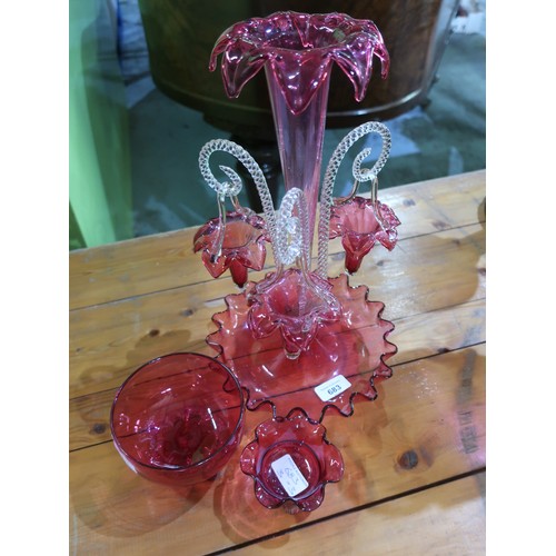 683 - Early 20th Cranberry glass Epergne with three baskets on clear scroll supports H37cm, and two simila... 