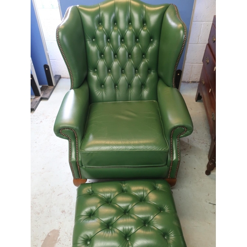 702 - Geo. III style wing back armchair brass nail upholstered in green leather on cabriole legs with loos... 