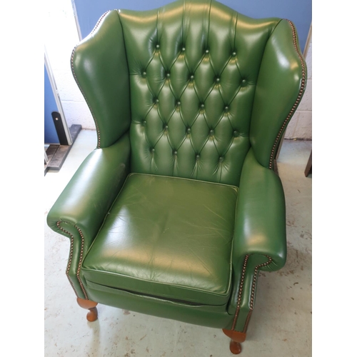 703 - Geo. III style wing back armchair brass nail upholstered in green leather on cabriole legs with loos... 