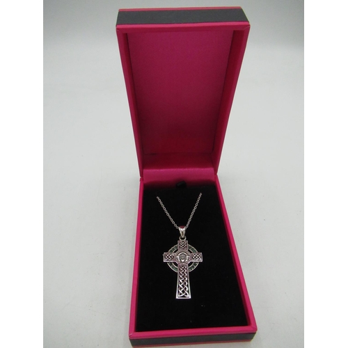 720 - Silver pendant necklace in the form of a cross with Claddagh style inscription to centre