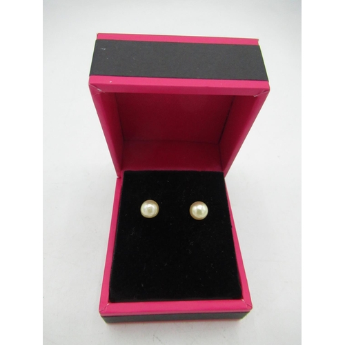 724 - Pair of cultured pearl studs on silver posts