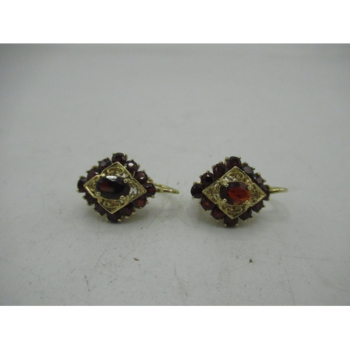 726 - Pair of 14ct yellow gold garnet set earrings
