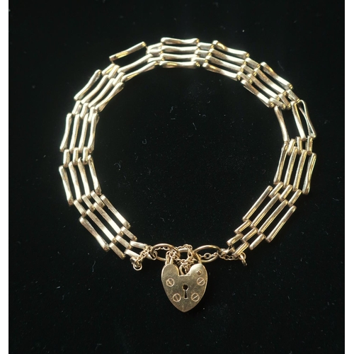 21 - Hallmarked 9ct gold 3 bar gate bracelet with safety chain and heart padlock clasp stamped 375 20.4g
