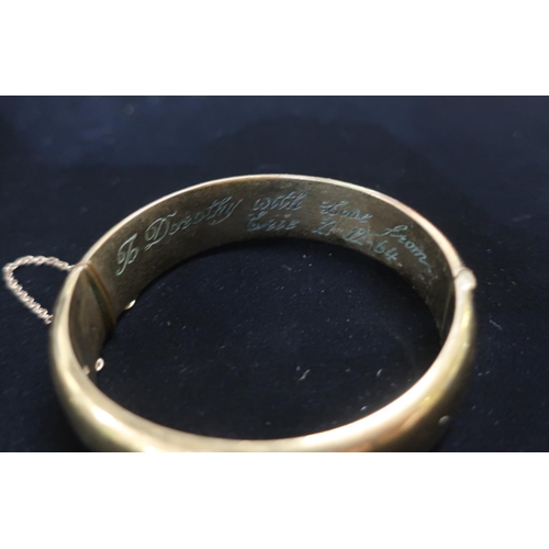 19 - Rolled gold hinged bangle with safety chain stamped 25.3g