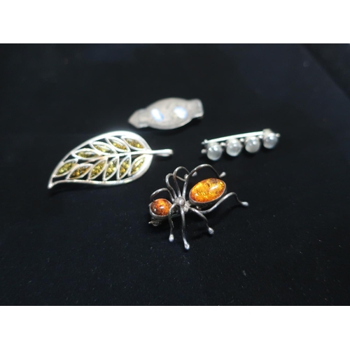 44 - Collection of brooches including Spider with amber set in silver mount stamped 925, another in the f... 