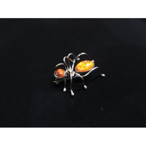 44 - Collection of brooches including Spider with amber set in silver mount stamped 925, another in the f... 