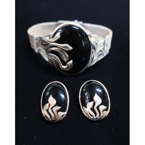 38 - Art Nouveau style Sterling silver bracelet and earring set with onyx and silver foliage centre and w... 