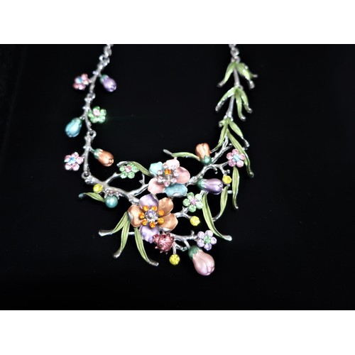 63 - Dress necklace with floral center piece decorated with multicolored painted flowers and stones and a... 